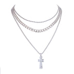 Silver chain necklaces with a cross pendant on a white background