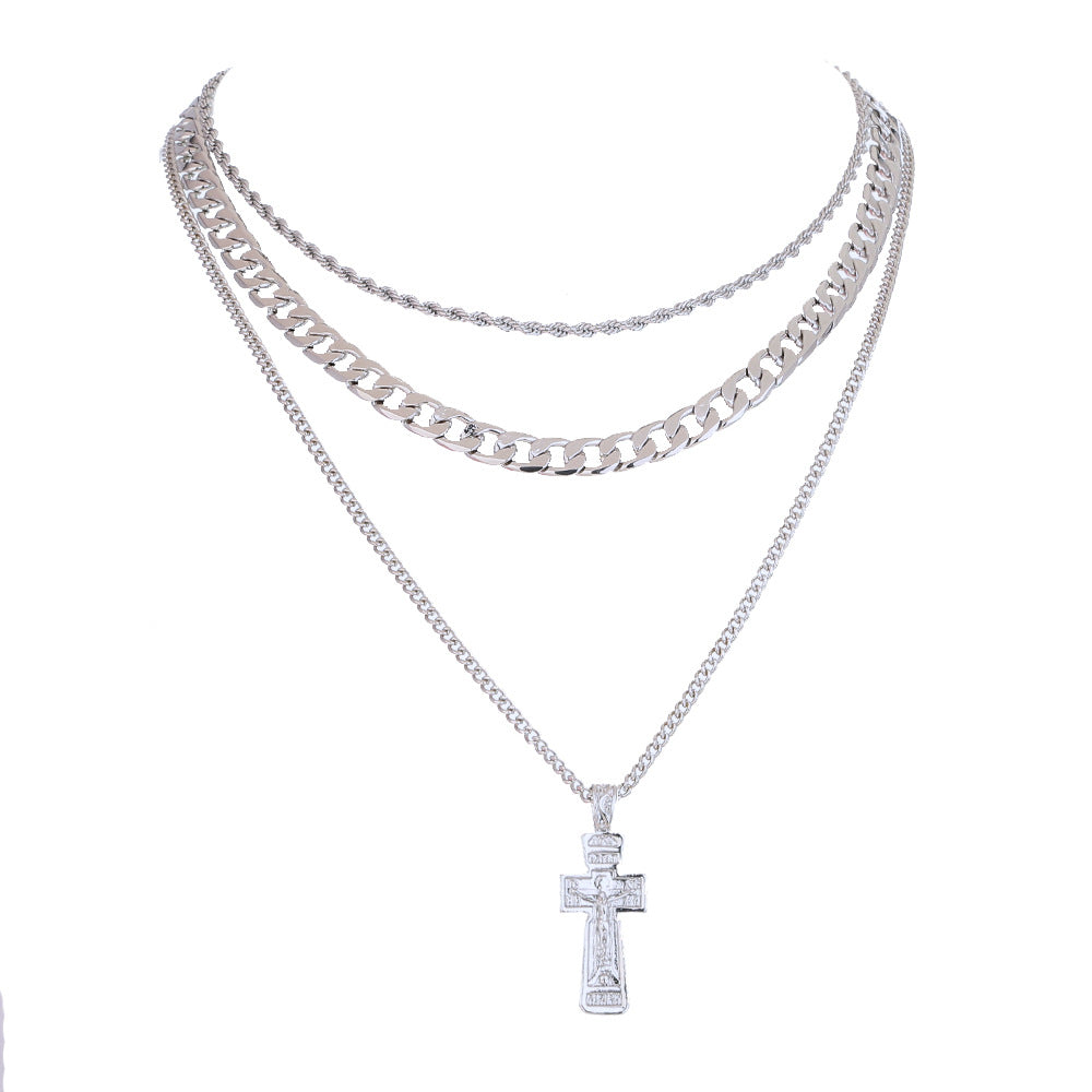 Silver chain necklaces with a cross pendant on a white background