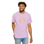 Man wearing a light purple t-shirt with a graphic design on a white background