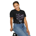 Person wearing a black t-shirt with 'Savage' design and blue jeans on a white background