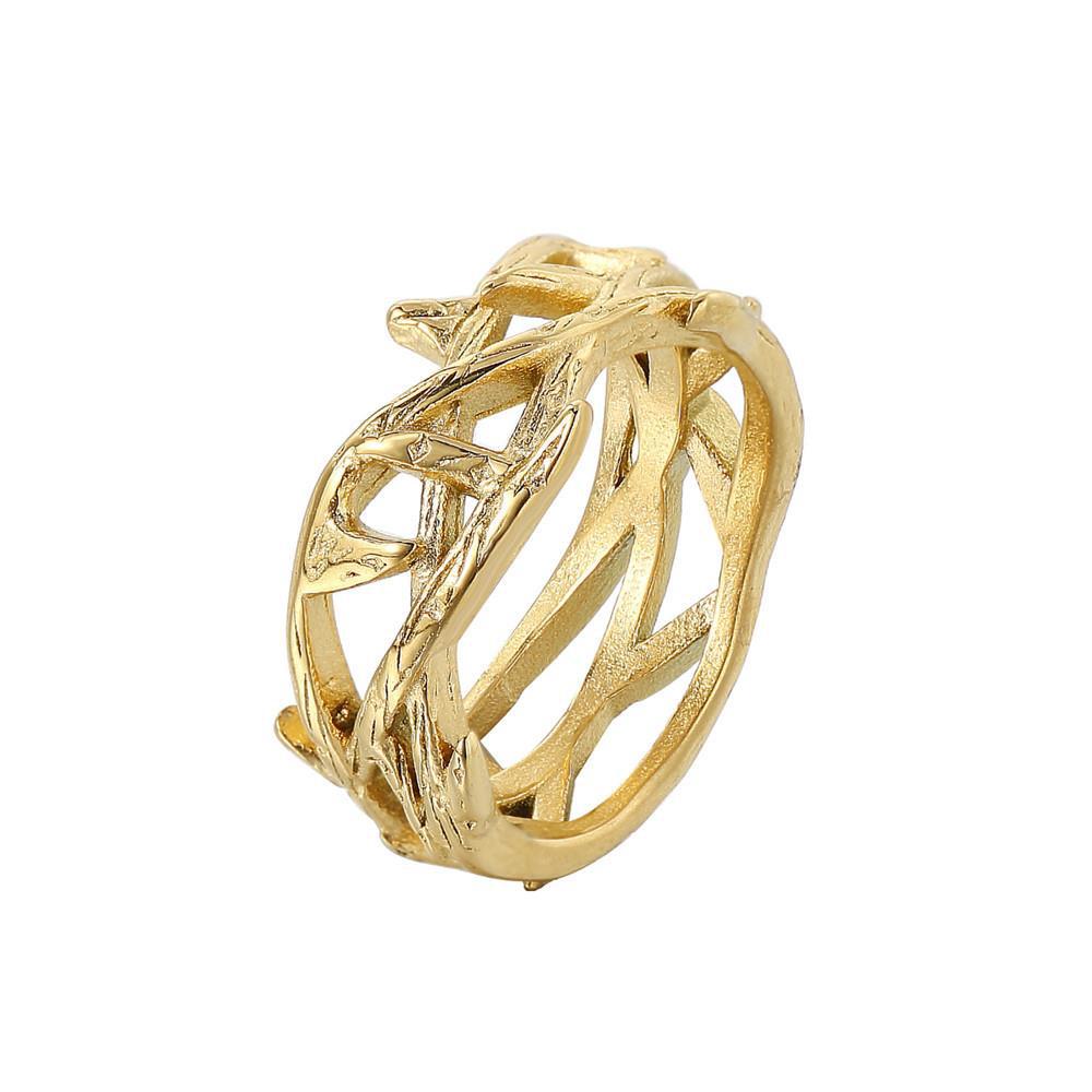 Gold ring with intricate design on a white background