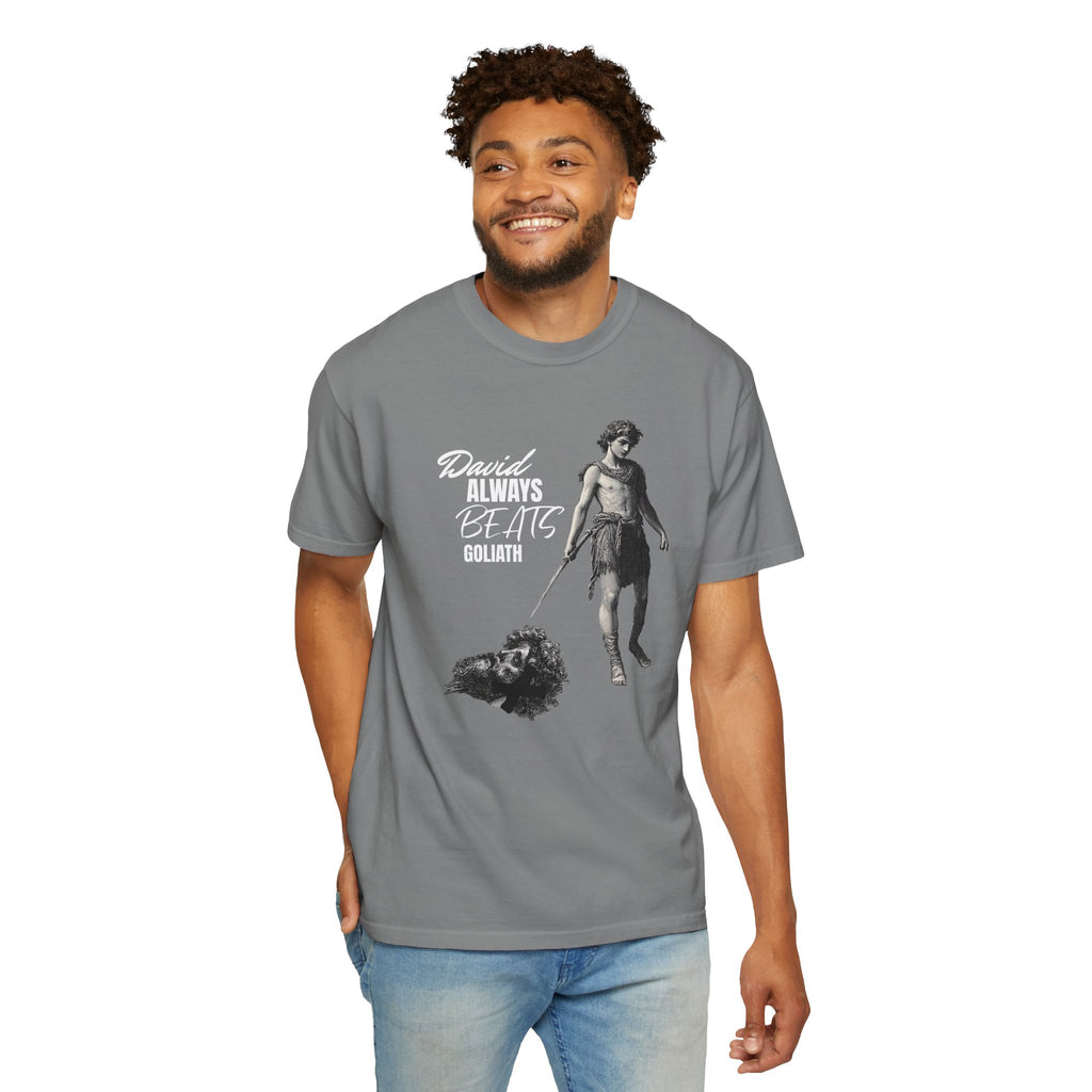Man wearing a gray t-shirt with a graphic design and text on a white background