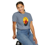 Person wearing a gray t-shirt with a colorful graphic design on a white background