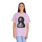 Person wearing a light purple t-shirt with a graphic design on a white background
