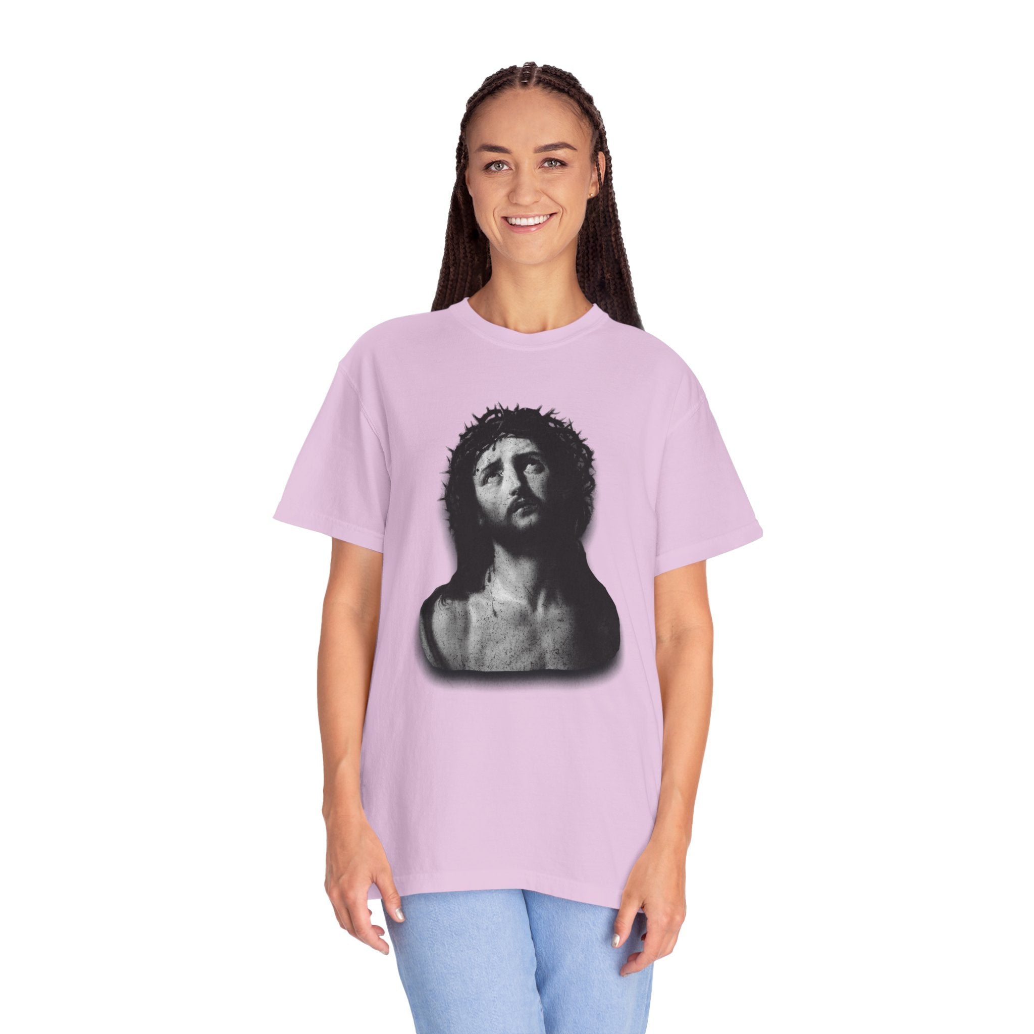 Person wearing a light purple t-shirt with a graphic design on a white background