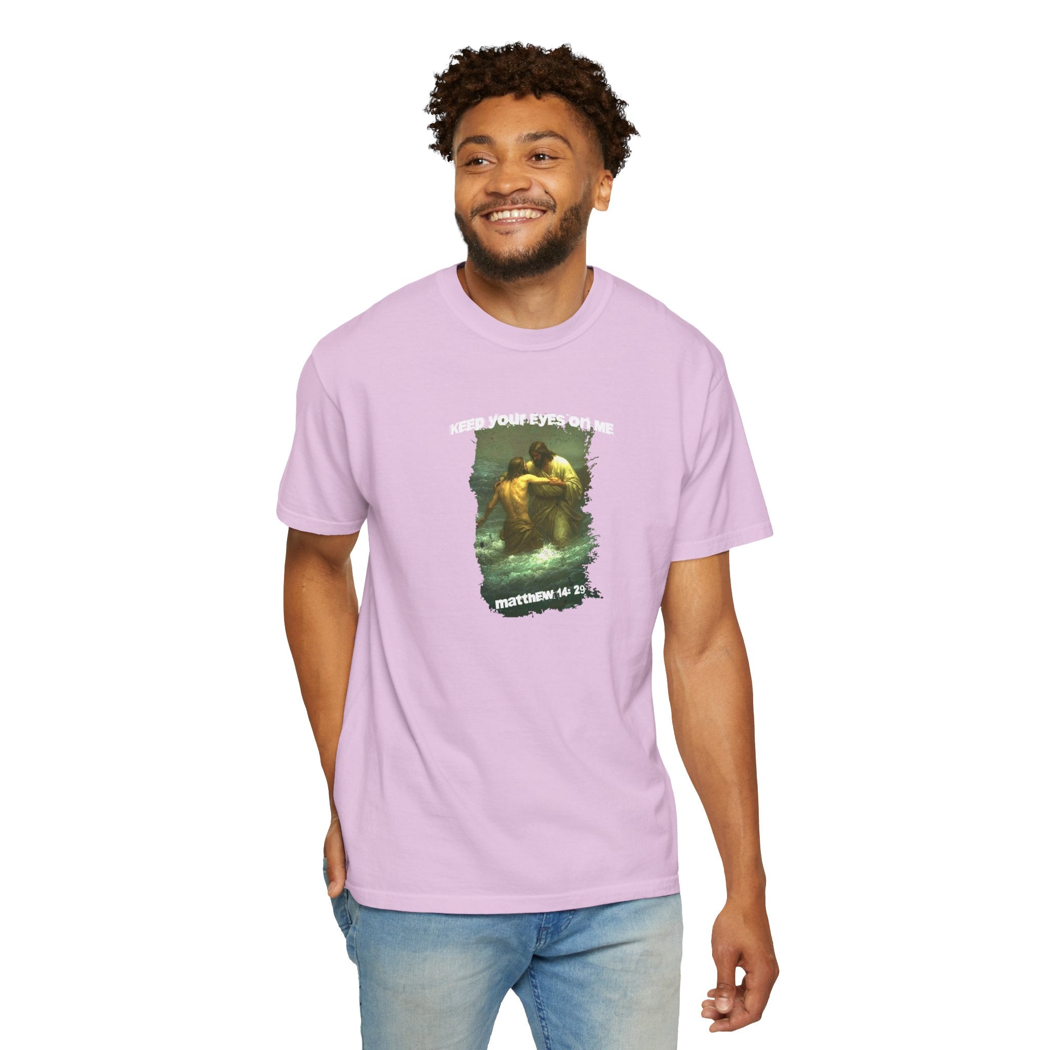 Man wearing a purple t-shirt with a graphic design on a white background