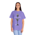 Person wearing a purple t-shirt with a graphic design on a white background