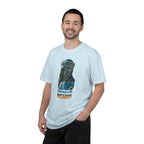 Man wearing a light blue t-shirt with a graphic design on a white background