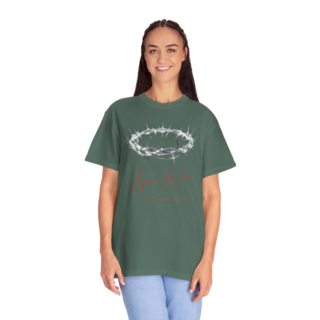Person wearing a green t-shirt with a design on a white background