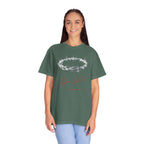 Person wearing a green t-shirt with a design on a white background