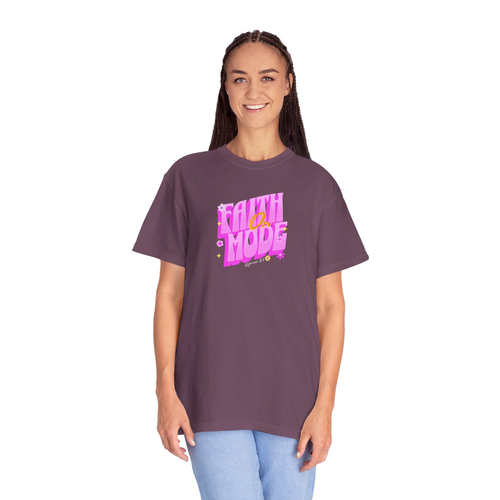 Woman wearing a purple t-shirt with 'Faith Mode' text on a white background