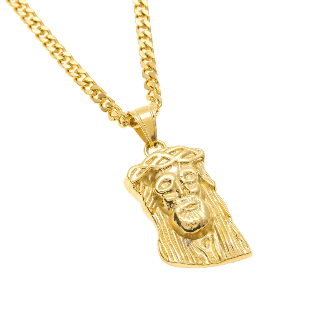 Gold necklace with a Jesus face pendant on a white background