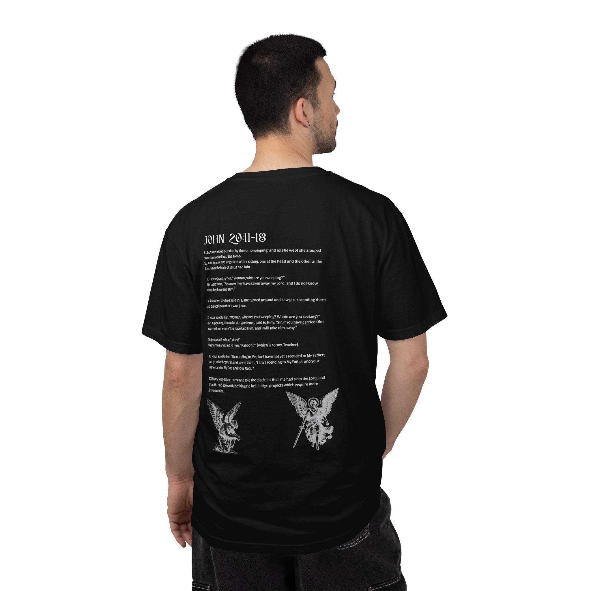 Man wearing a black t-shirt with white text and graphics on the back, standing against a white background.