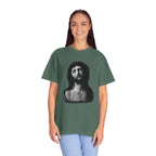 Person wearing a green t-shirt with a graphic design on a white background
