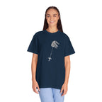Person wearing a navy blue t-shirt with a graphic design on a white background