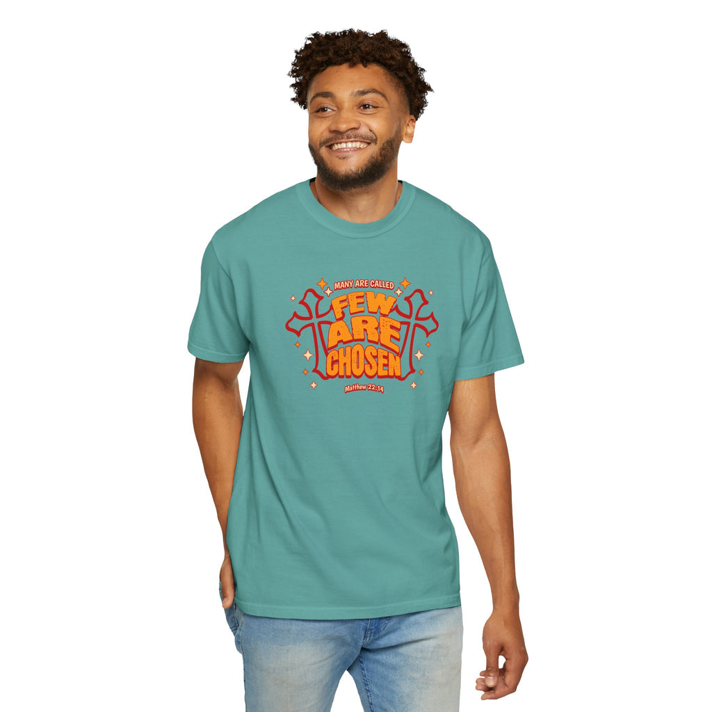 Man wearing a teal t-shirt with red and orange graphic design on a white background