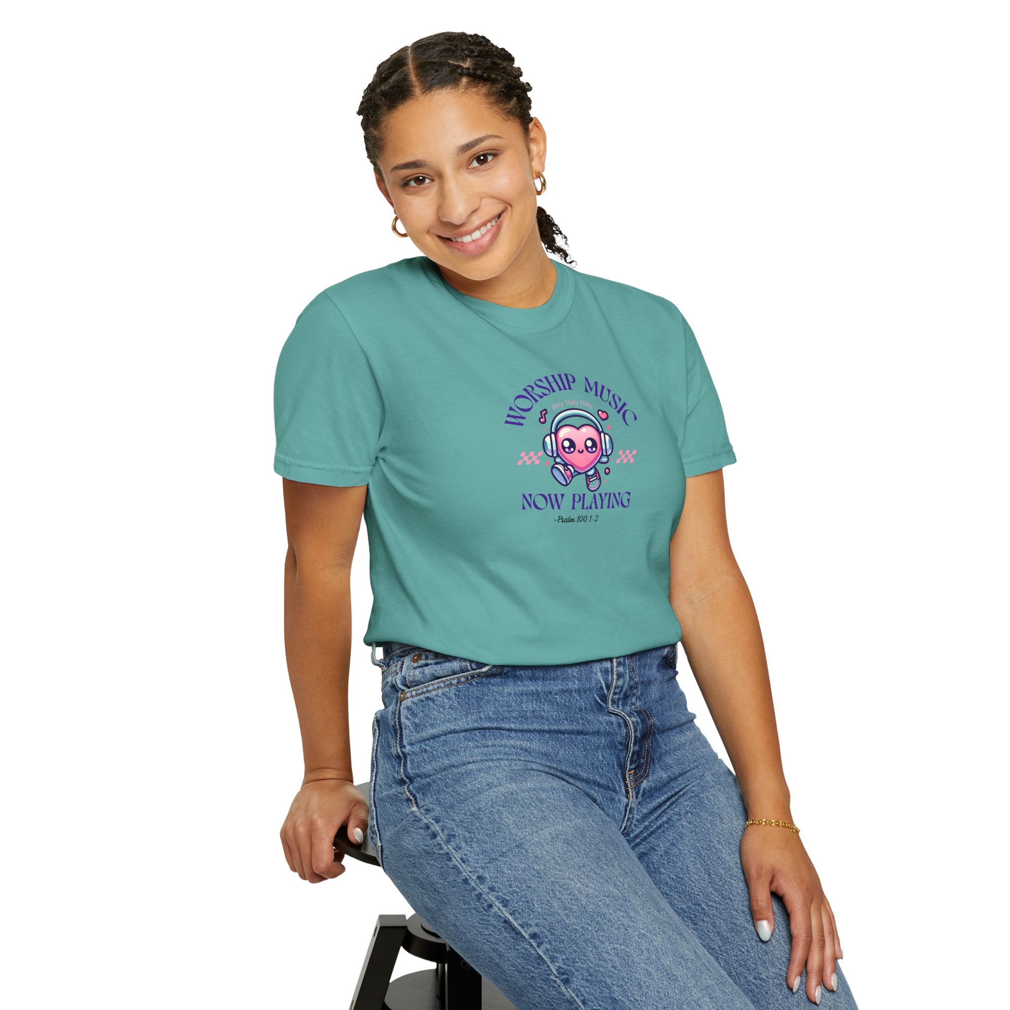 Person wearing a teal t-shirt with a graphic design on a white background