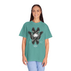 Person wearing a teal t-shirt with a graphic design on a white background