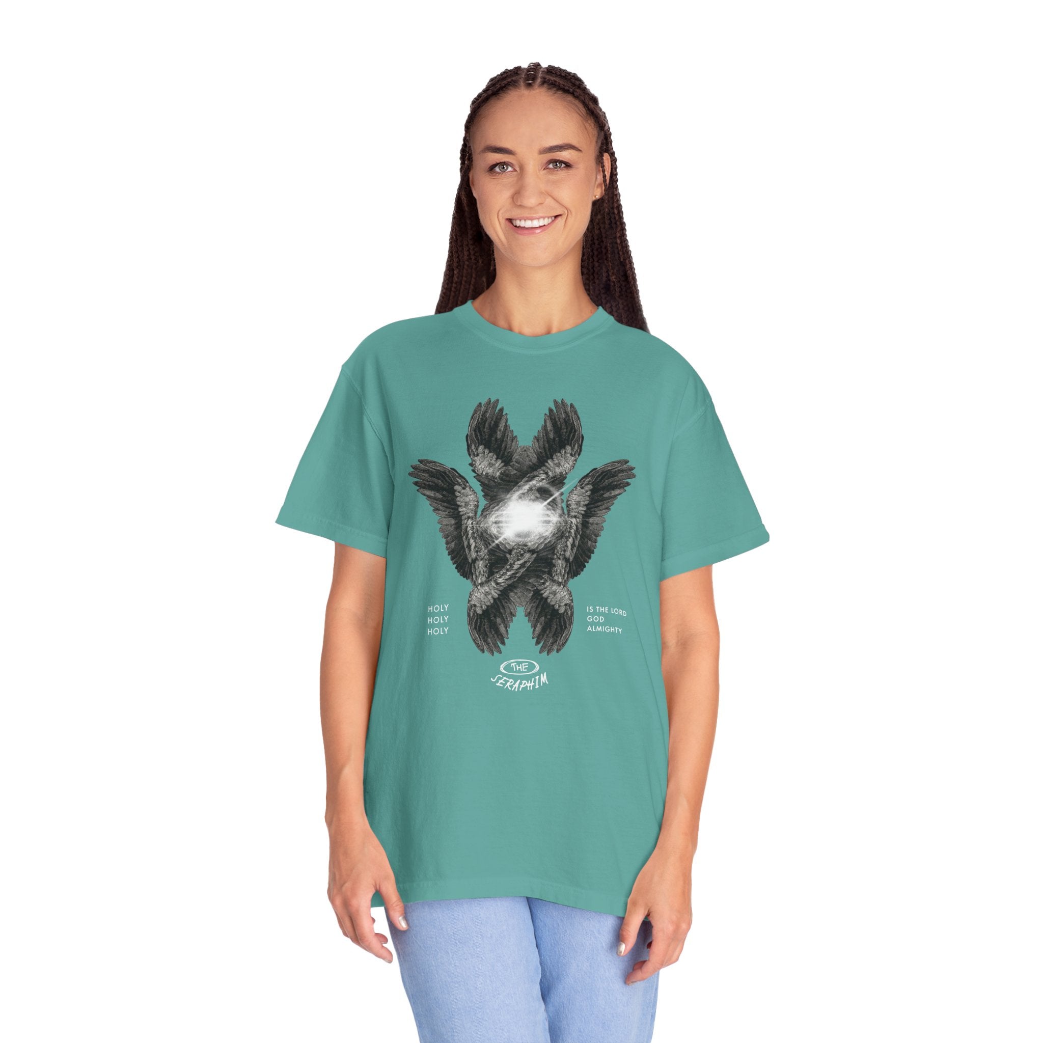 Person wearing a teal t-shirt with a graphic design on a white background