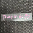 Clear decal with 'Trust in God' text on a textured black background