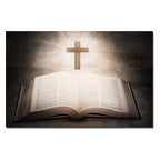 Open book with a cross above it on a dark background