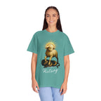 Person wearing a teal t-shirt with a graphic design and the word 'Victory' on a white background