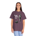 Person wearing a purple t-shirt with a graphic design and text on a white background