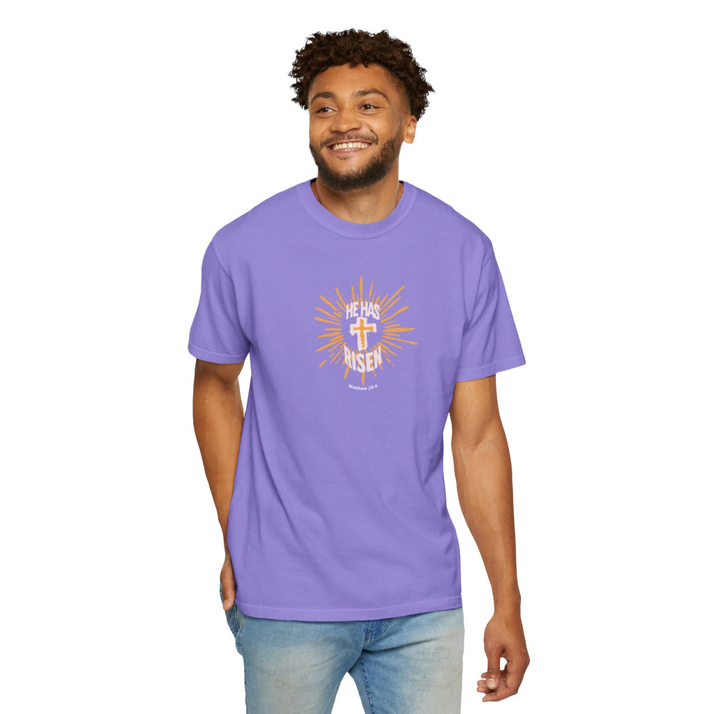 Man wearing a purple t-shirt with a graphic design on a white background