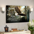 Canvas print with an eagle and motivational quote on a wall above a wooden shelf.