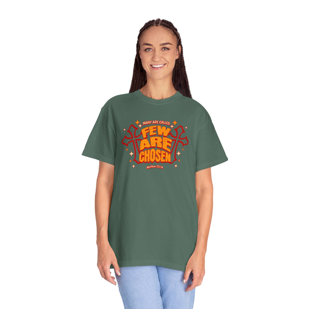 Person wearing a green t-shirt with orange text on a white background