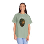 Person wearing a green t-shirt with a graphic design on a white background