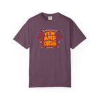 Purple t-shirt with red and white text and graphics on a white background
