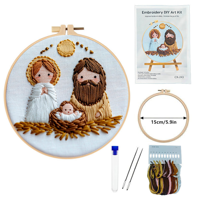 Embroidery DIY art kit with completed embroidery of a nativity scene, tools, and packaging on a white background.