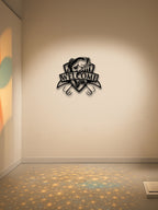Metal wall art with 'Welcome' text on a beige wall