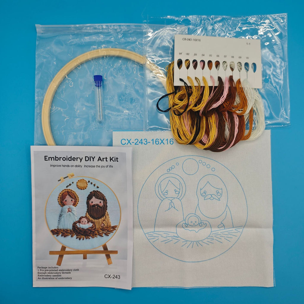 Embroidery DIY art kit with hoop, threads, and pattern on a blue background