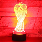 3D angel-shaped lamp with a red brick background