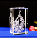 Crystal Nativity scene figurine on a reflective surface with a dark background