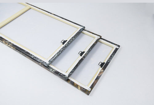 Two marble-patterned picture frames on a white background