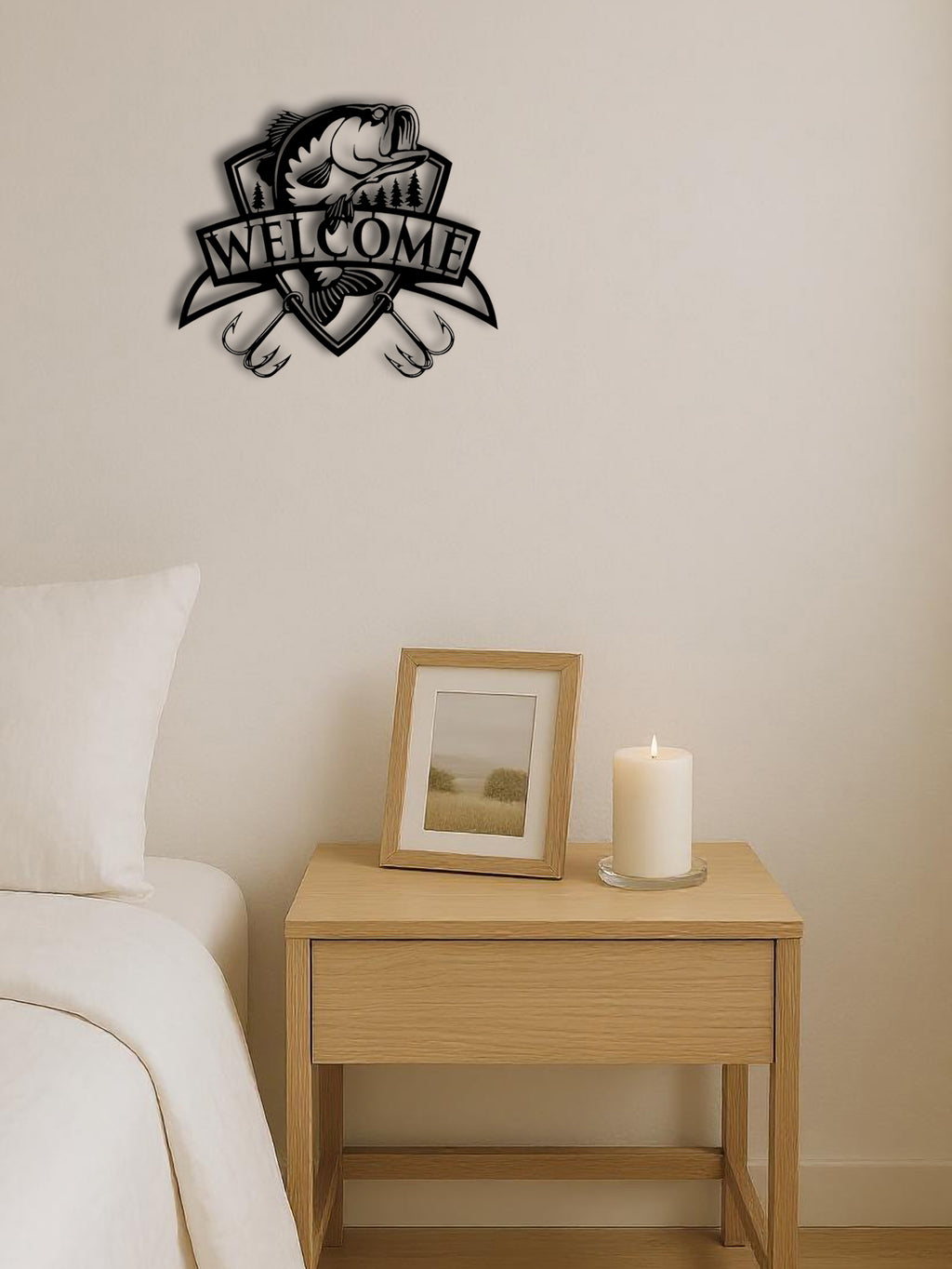 Decorative wall art with 'Welcome' and paw prints on a bedroom wall above a nightstand with a candle and framed picture.