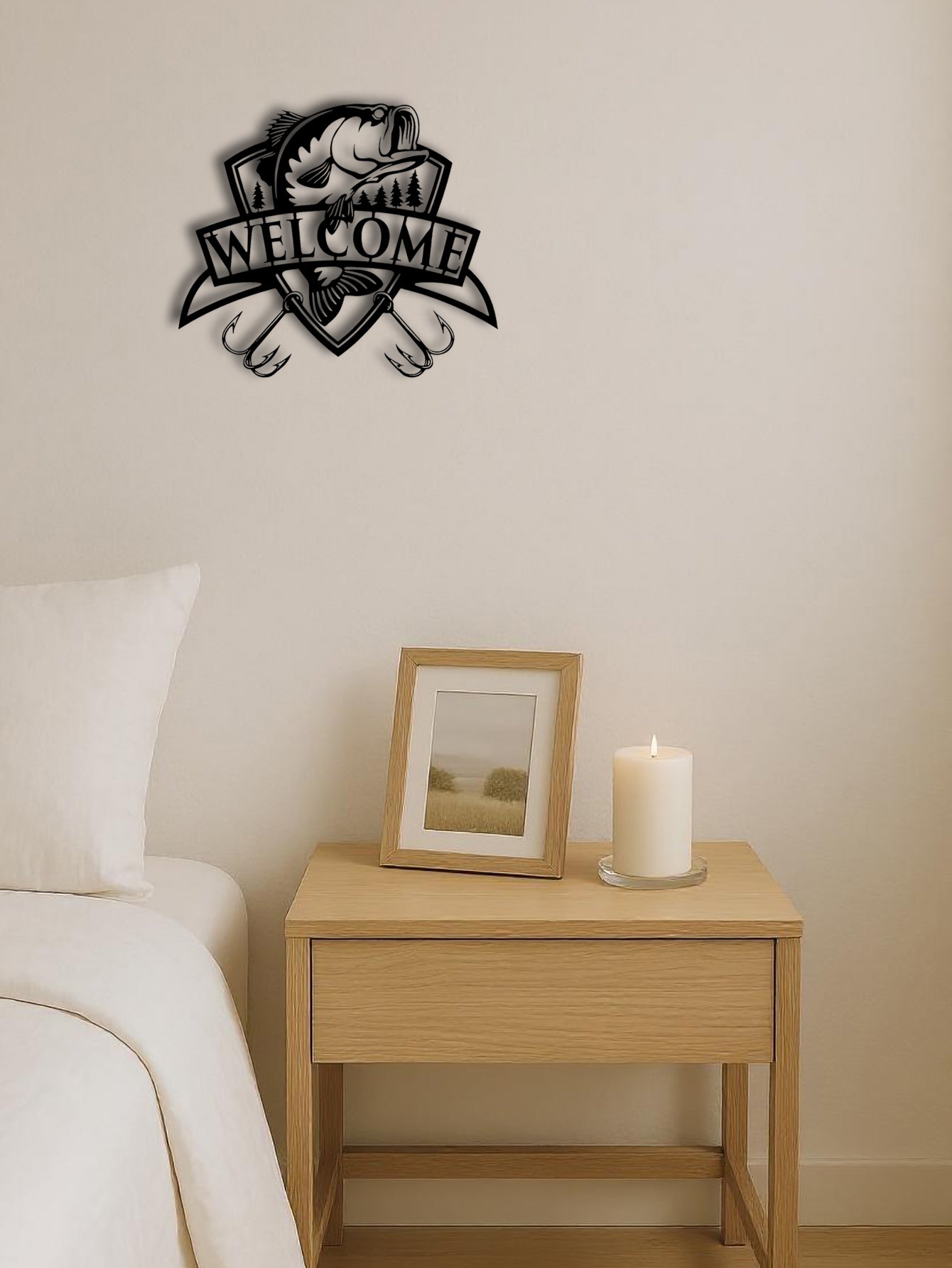 Decorative wall art with 'Welcome' and paw prints on a bedroom wall above a nightstand with a candle and framed picture.