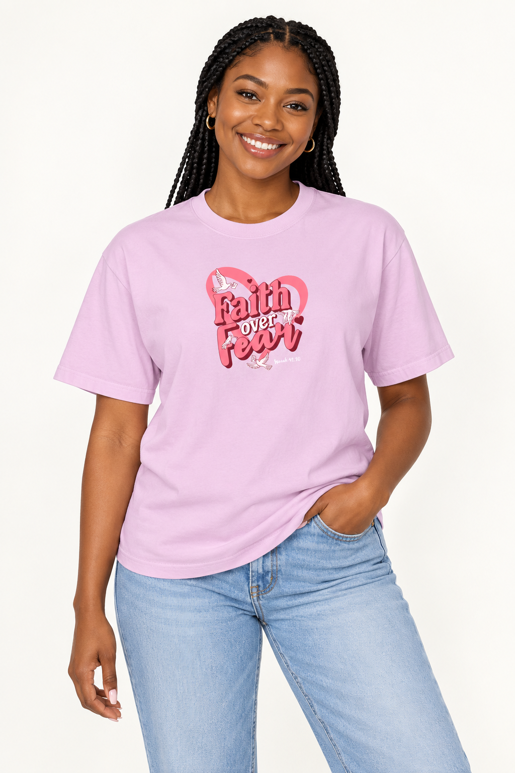 Model wearing the pink Faith Over Fear unisex T-shirt in a studio
